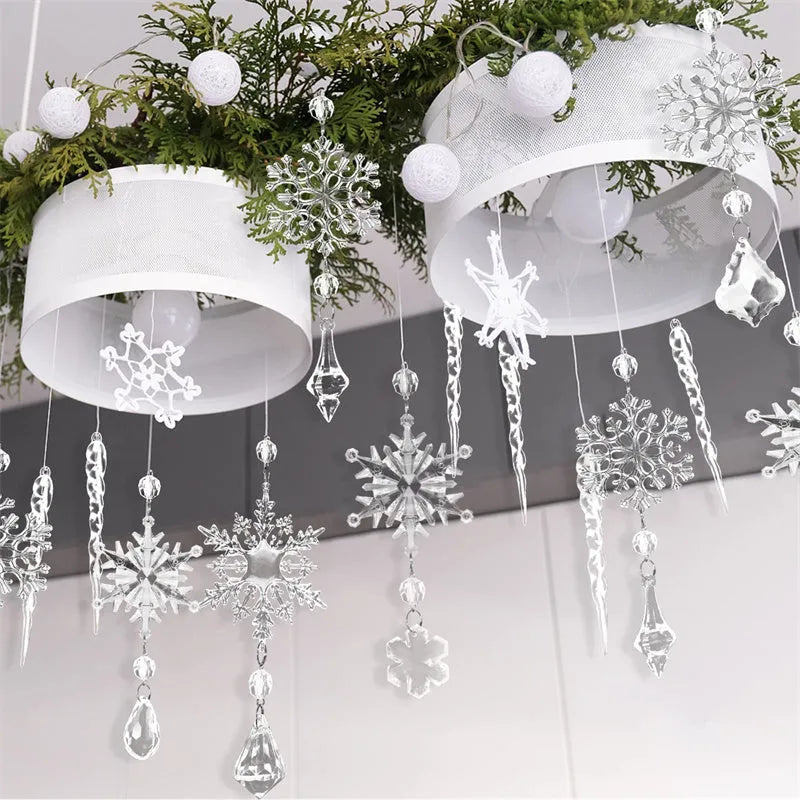 Ten clear transparent acrylic ice cone Christmas tree ornaments with white ribbons on green branches.
