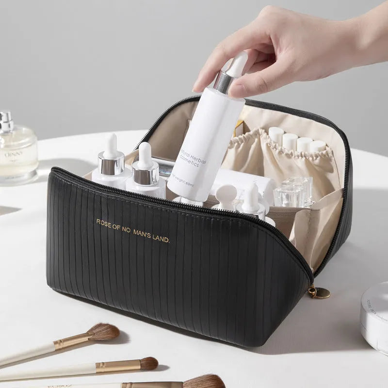 Vertical stripe pattern cubic makeup bag in PU material measuring 22.5cm wide
