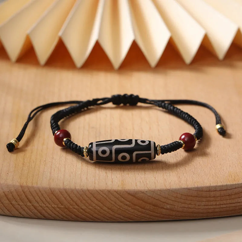 Tibetan agate dzi bead bracelet with adjustable shrinkable fit showing natural stone beads