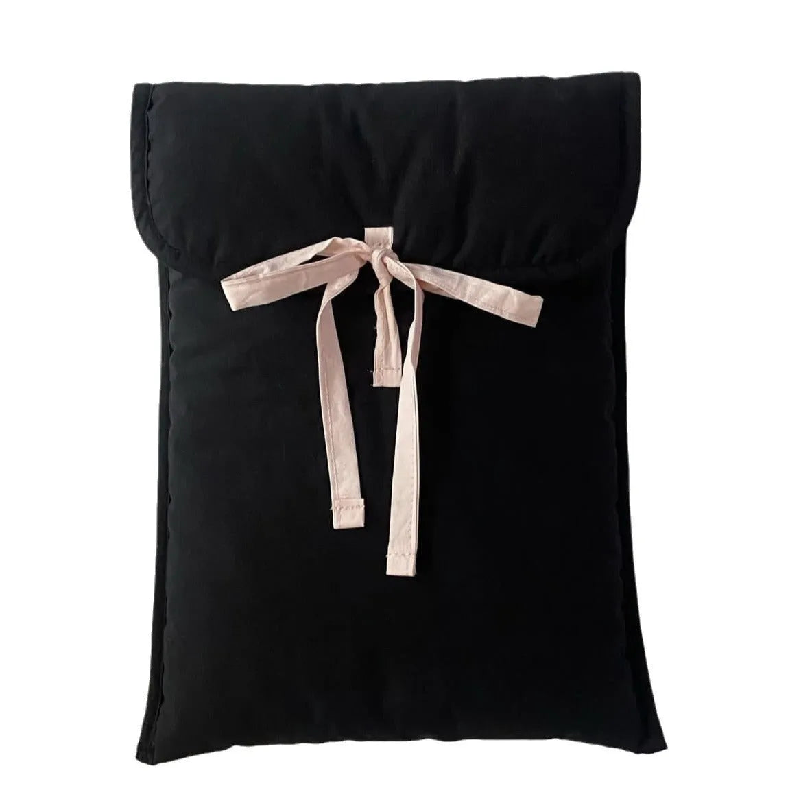 Women's black and white striped quilted laptop bag with a large ballet-style bow on the front.