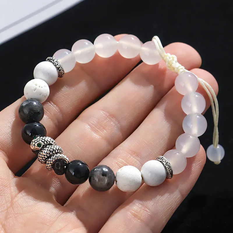 Black and white agate couple bracelets with snake clasps, turquoise accents, and glitter beads