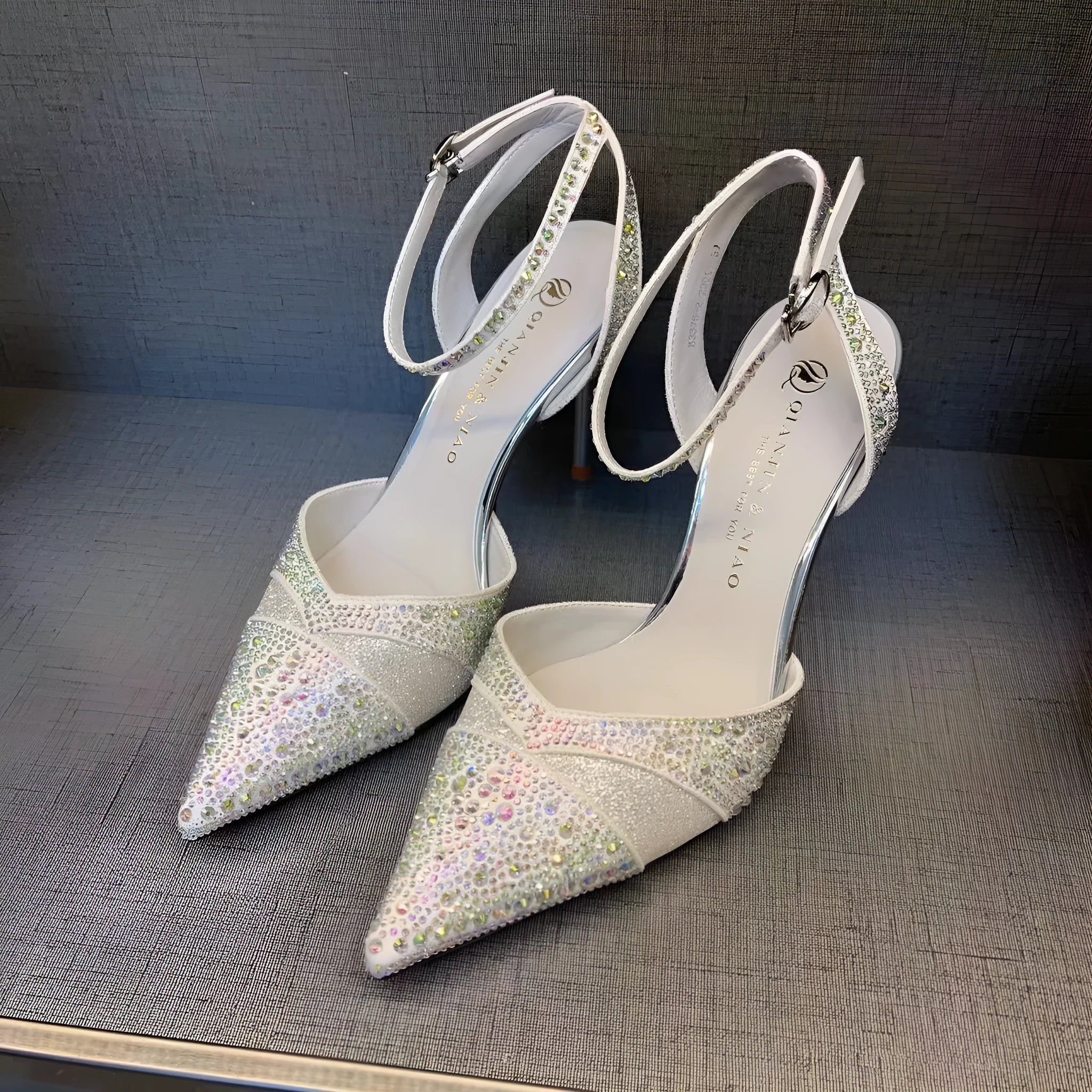 Women's black pointed-toe stiletto high heels with a hollow heel and red sole