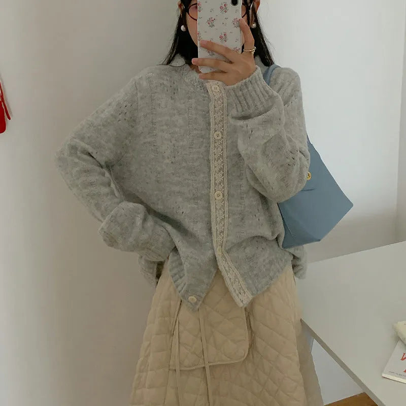 Loose fit artistic retro cardigan in viscose fibre shown in apricot colour.