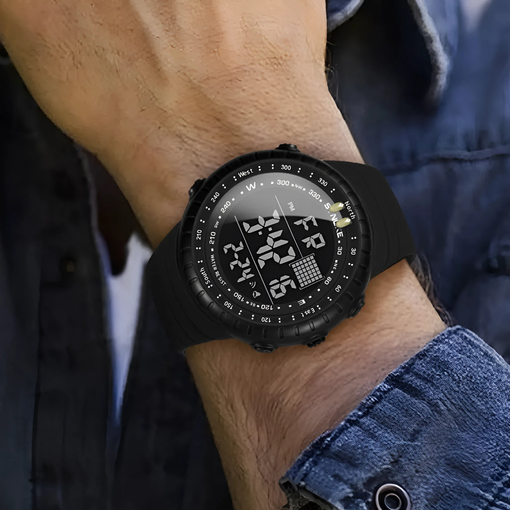 Black digital outdoor watch with large dial and PU strap on a wrist.