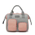 Grey Oxford cloth handbag showing its three-dimensional front pocket and large main compartment.