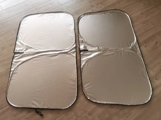Aluminium foil car sunshade showing titanium silver colour, folded concertina-style.