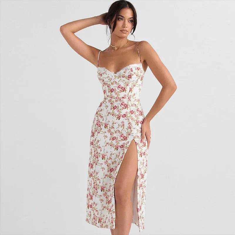 Women's long blue summer dress with lace flowers print, suspender straps, and a side slit.