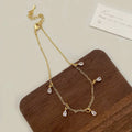 Zircon jewellery set showing necklace, earrings and anklet with geometric Korean-style design