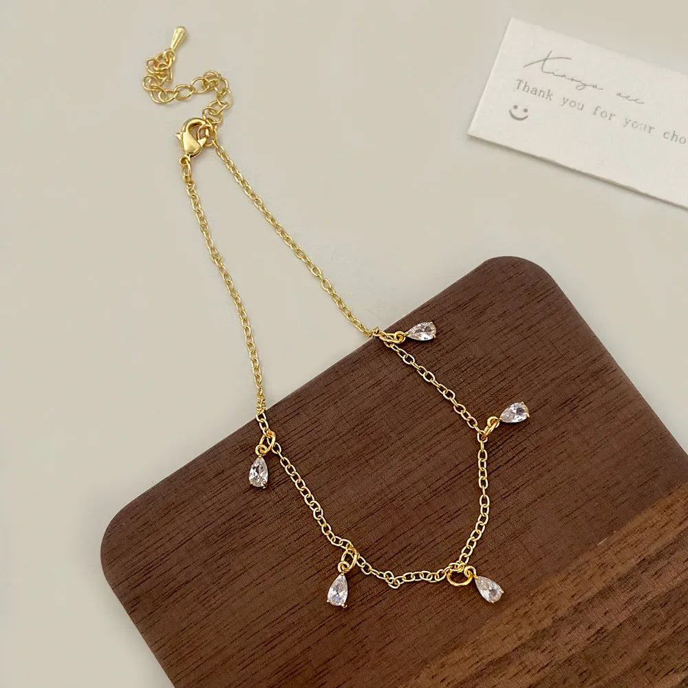 Zircon jewellery set showing necklace, earrings and anklet with geometric Korean-style design