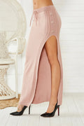 Acrylic slim-fit mid-length skirt with side split and strap detailing in black colour