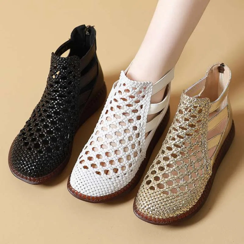 Women's flat sandals with hollow-out design and round toe in gold colour on white background