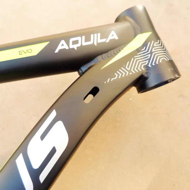 Black green aluminium mountain bike frame for 29-inch wheels with disc brake mount and internal cable routing ports.