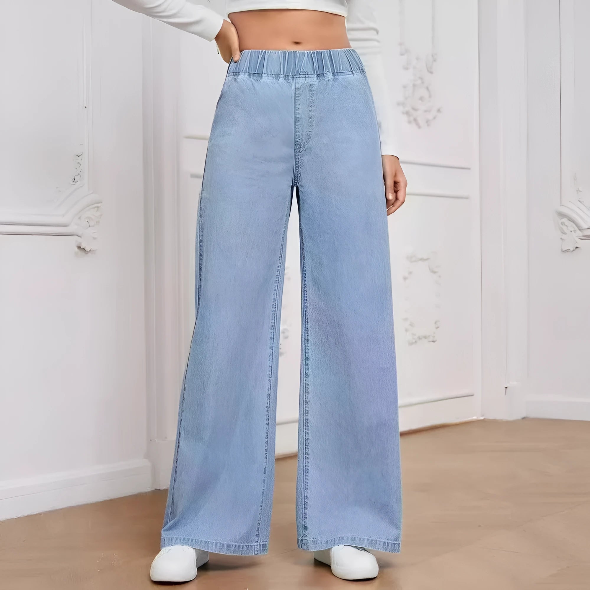 Light blue washed wide-leg denim jeans on a hanger, showing straight leg and mid waist design.