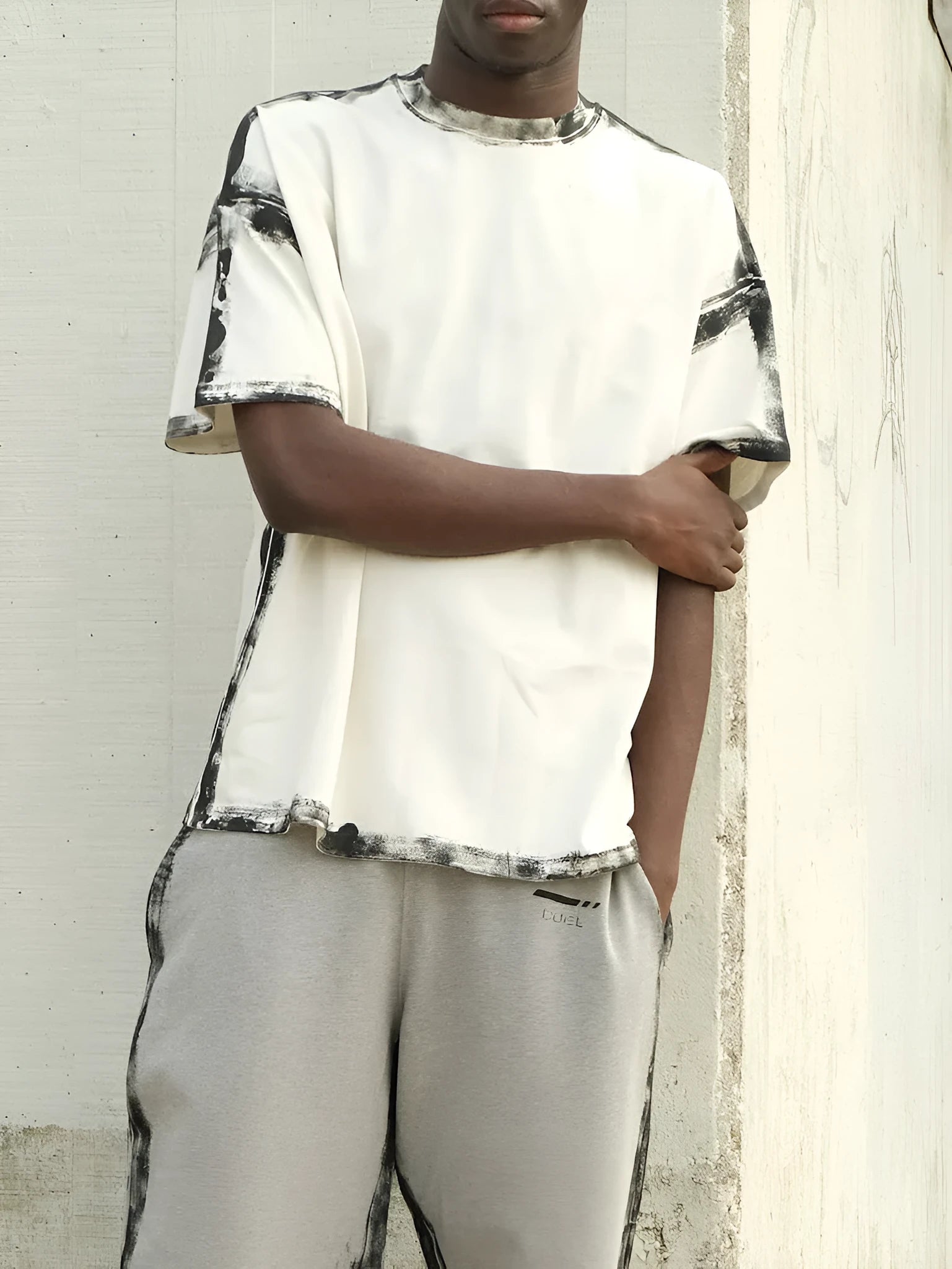 White casual short sleeve top with draped design and printed elements