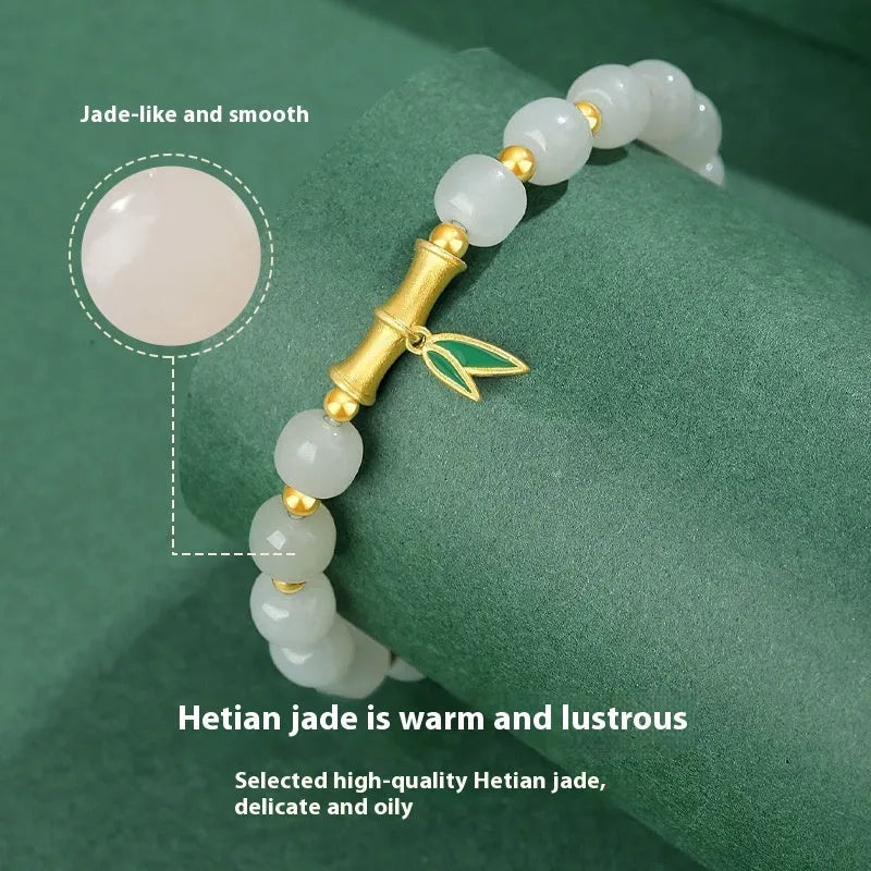 Sterling silver bracelet with gold Hetian jade beads and bamboo leaf charms