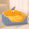 Green triangular cat bed with a thick sponge pad and removable fabric cover.