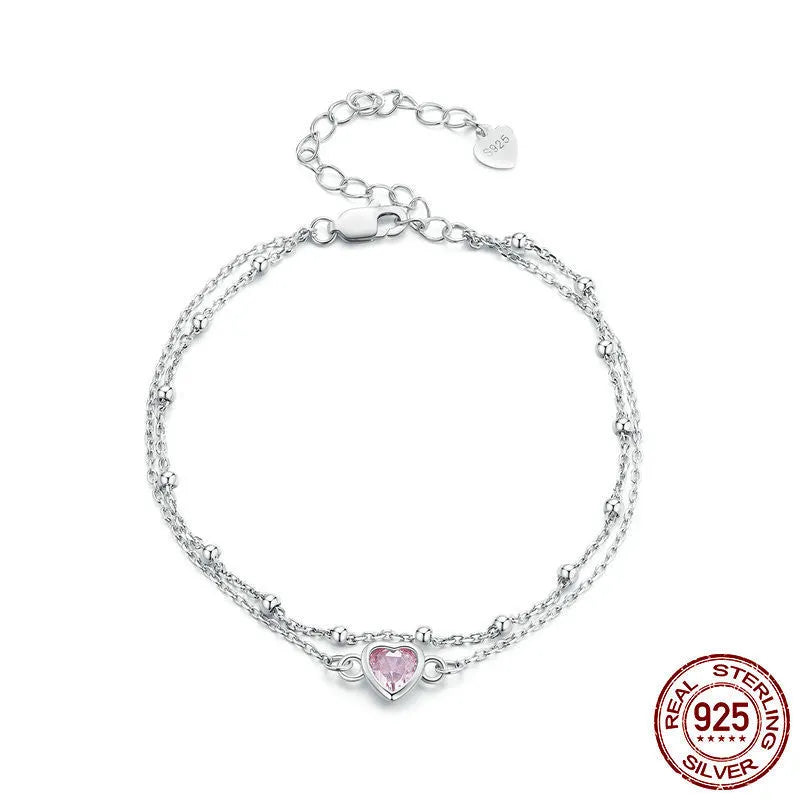 Sweet girlish heart-shaped 925 sterling silver bracelet on wrist, colour BSB152.