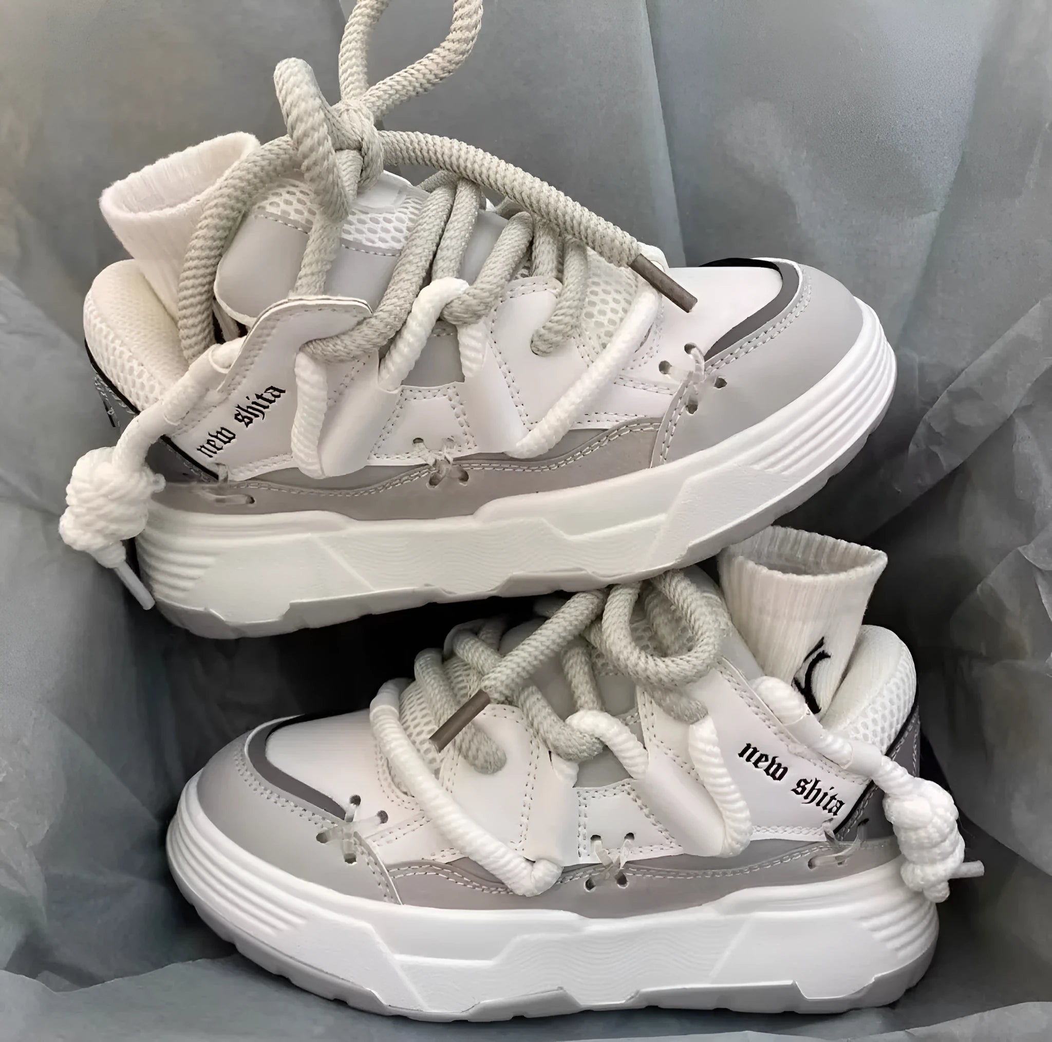 Women's grey retro chunky sneakers with thick rubber platform sole and lace-up front.
