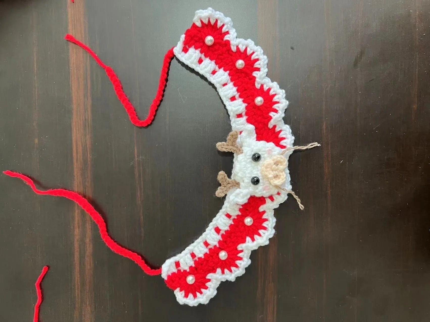 Knitted wool Christmas pet scarf collar in striped Santa Claus design on dog