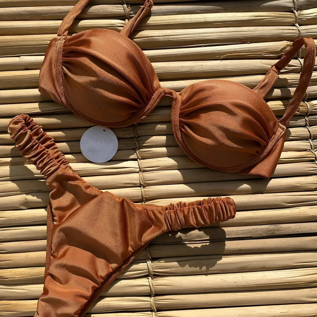 Women's black underwire bikini swimsuit set on a mannequin, showing sleeveless briefs style.