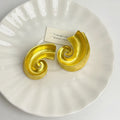Retro geometric alloy ear studs in gold or silver colour, 5cm size.