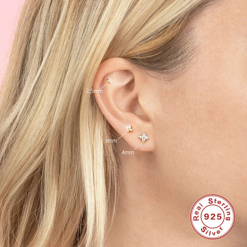 S925 sterling silver petal-shaped stud earrings with crystal flower details in gold and platinum finishes.