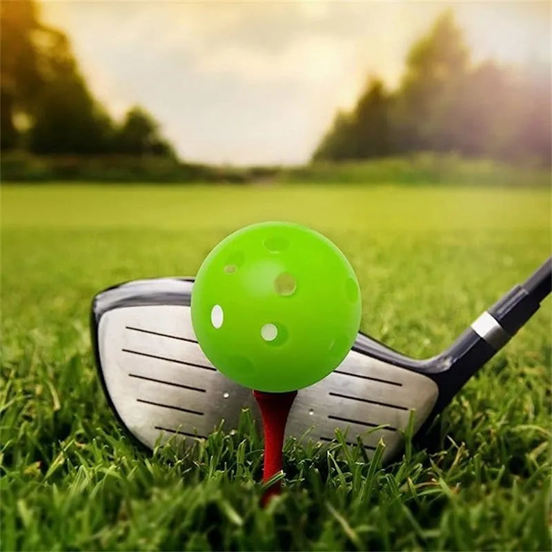 Multi-colour golf practice balls with a 26-hole target mat, stored in a net pocket.
