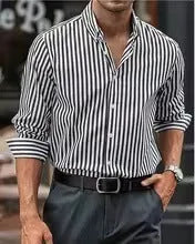 Man wearing a loose-fit khaki striped button-down cardigan-style shirt.