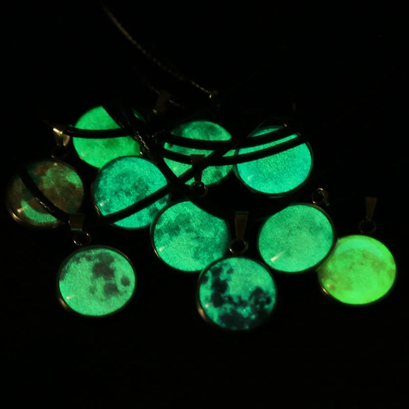 Close-up of a constellation design glass pendant on an alloy chain necklace with extension.