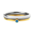Geometric engraved titanium steel ring with December birthstone colour and electroplated gold handle.