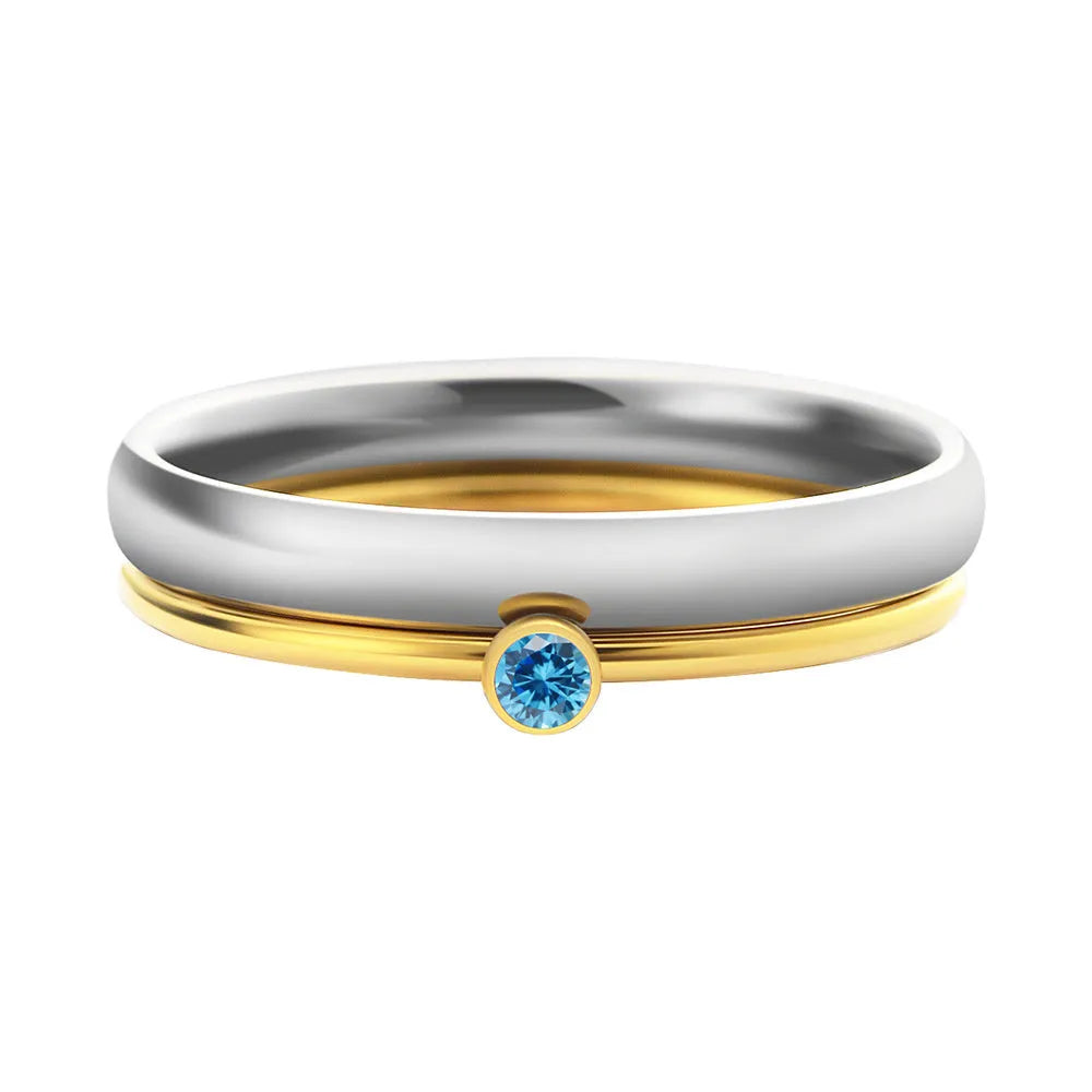 Geometric engraved titanium steel ring with December birthstone colour and electroplated gold handle.