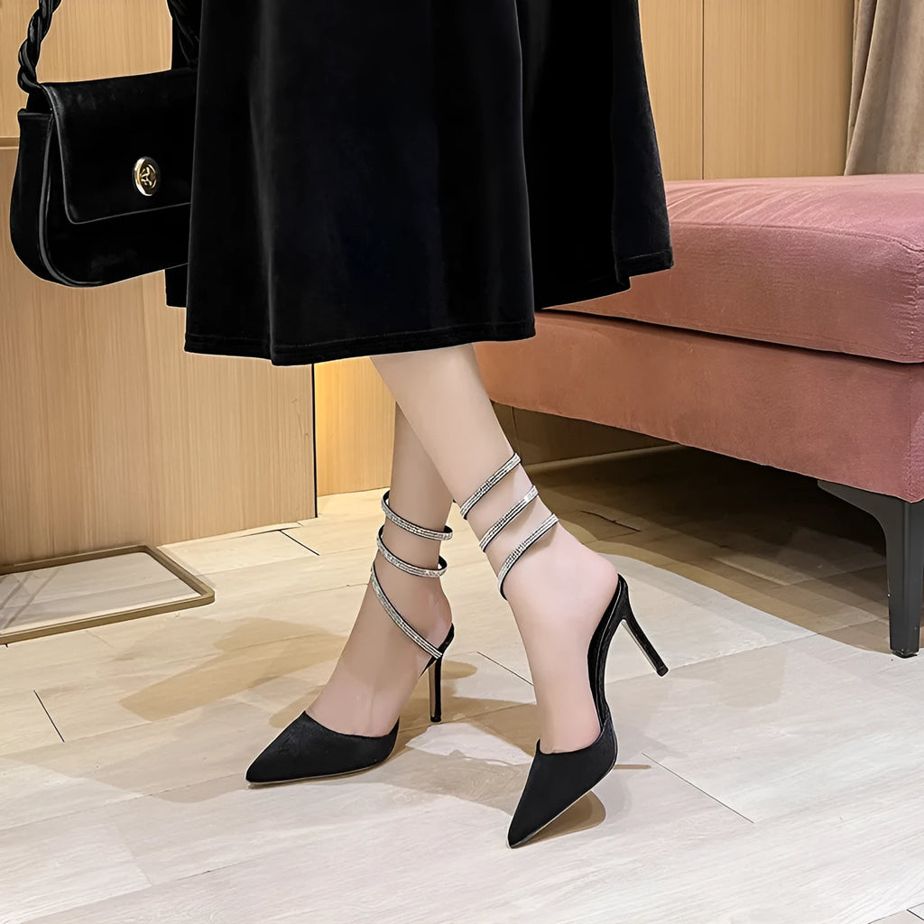 Women's pointed stiletto heel high heels in black velvet with ankle strap cross tie closure
