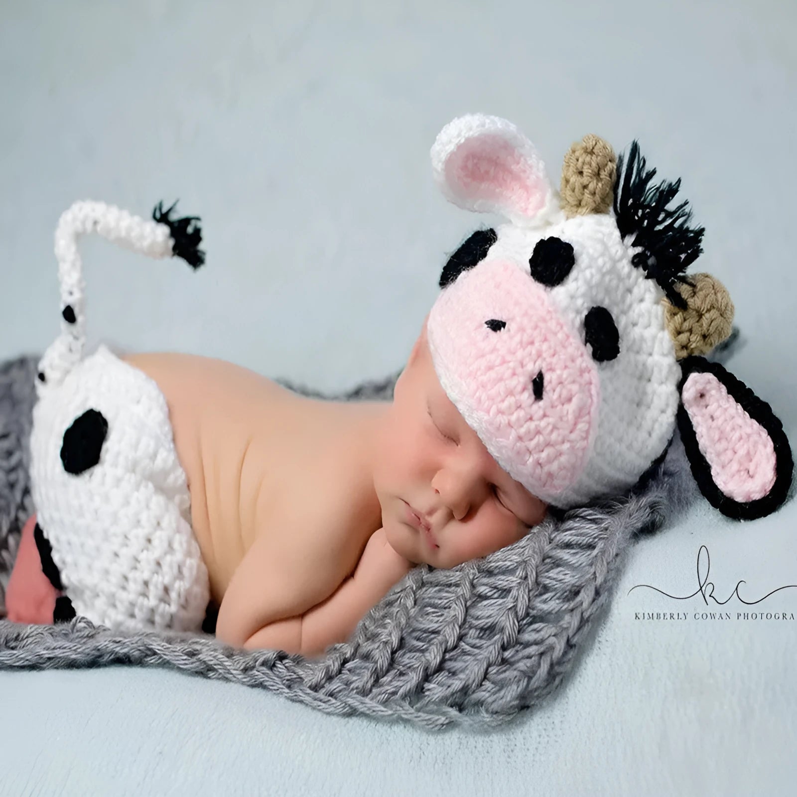 Hand-knitted white newborn cow suit with matching hat and trousers for 0-3 month babies
