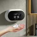 White automatic hand sanitizer foam dispenser mounted on wall with infrared sensor