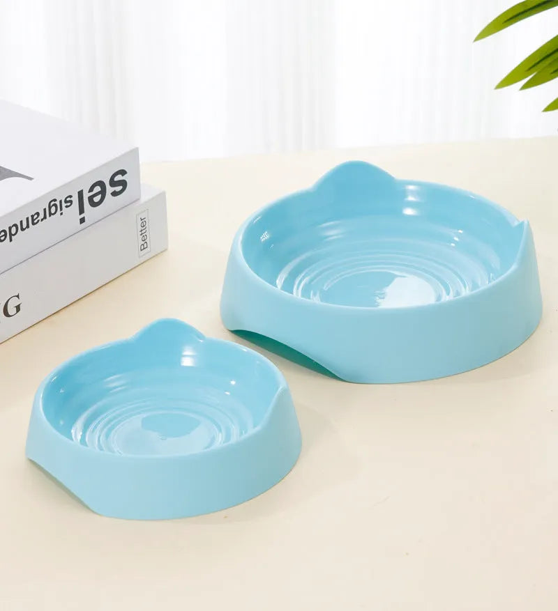 Ceramic dog slow feeder bowl with puzzle cups in blue, shown in large and small sizes.