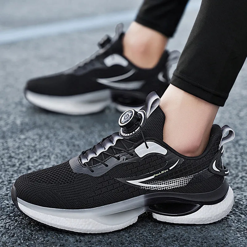 Men's beige Korean style running shoes with rotating button closure on a grey background.
