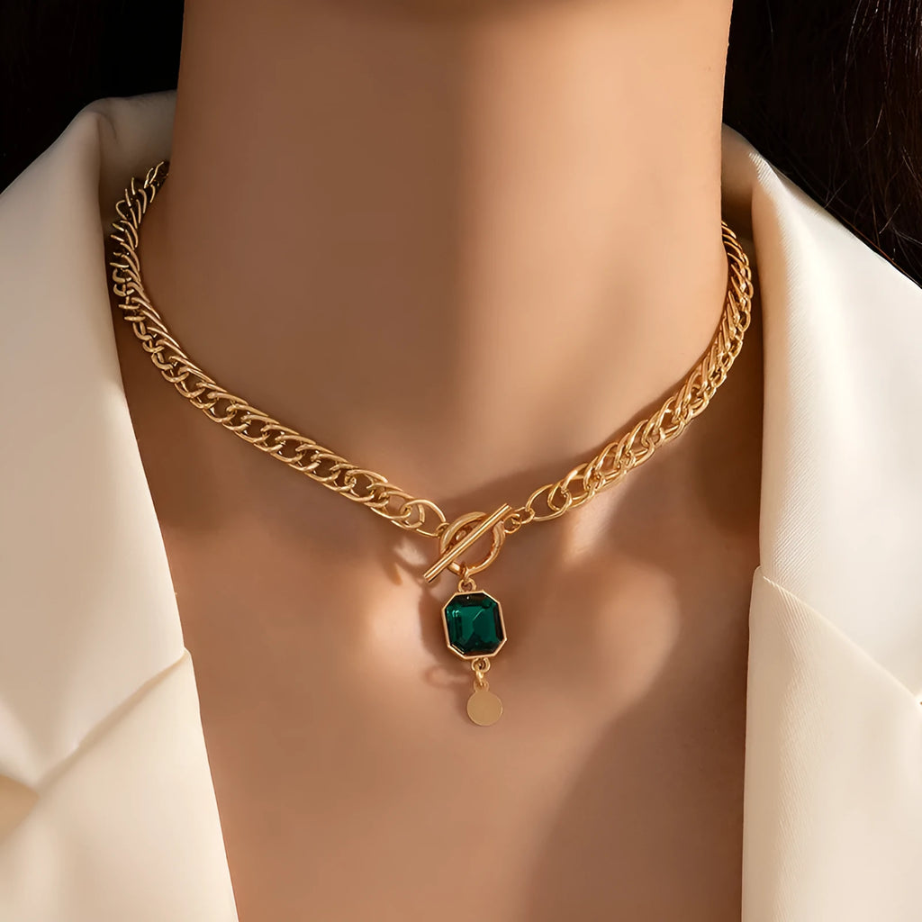 Gold electroplated titanium steel pendant necklace with emerald zircon stone in geometric round shape