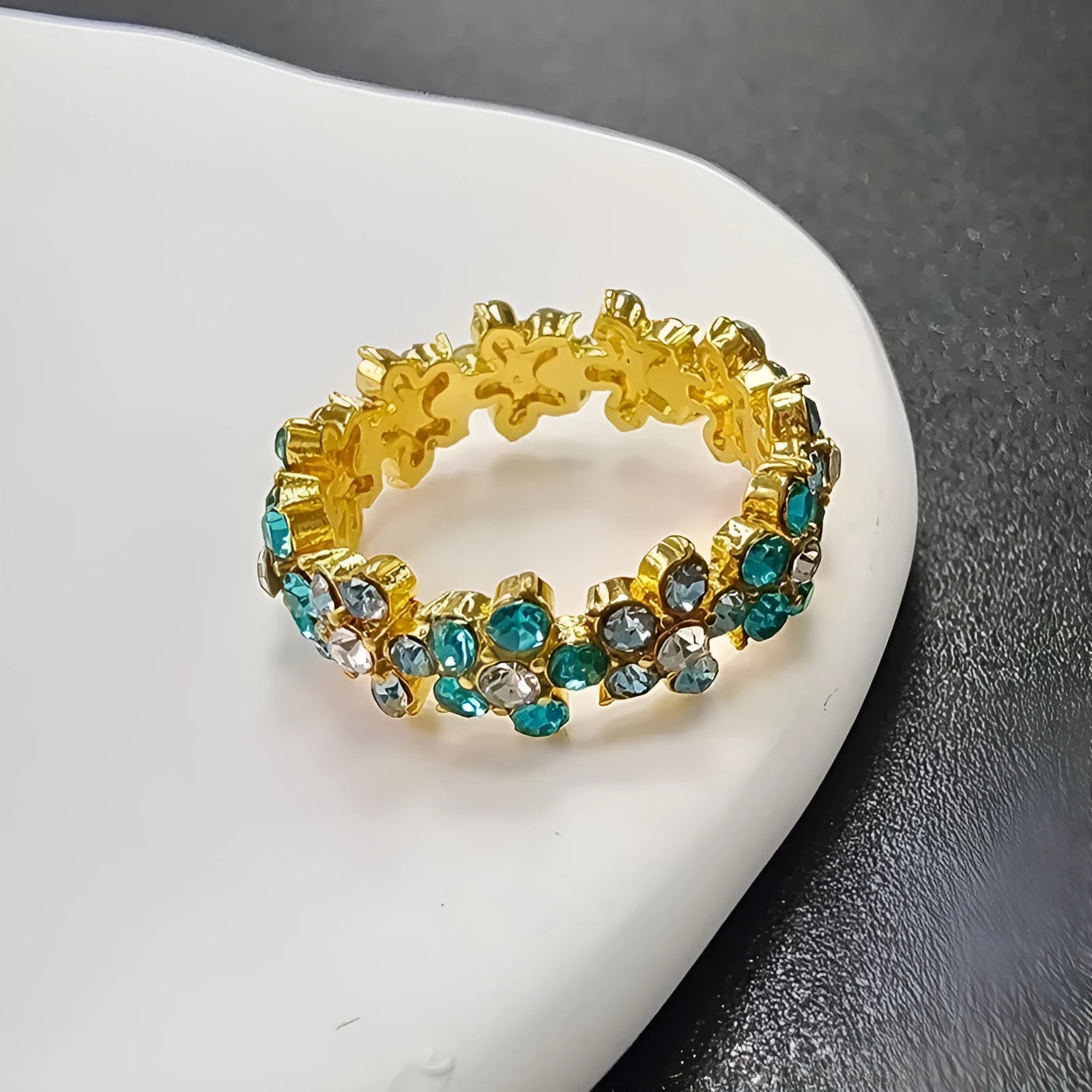 Elephant design fashion ring with diamond accents on an alloy band, shown in electroplated silver and gold colour variants.