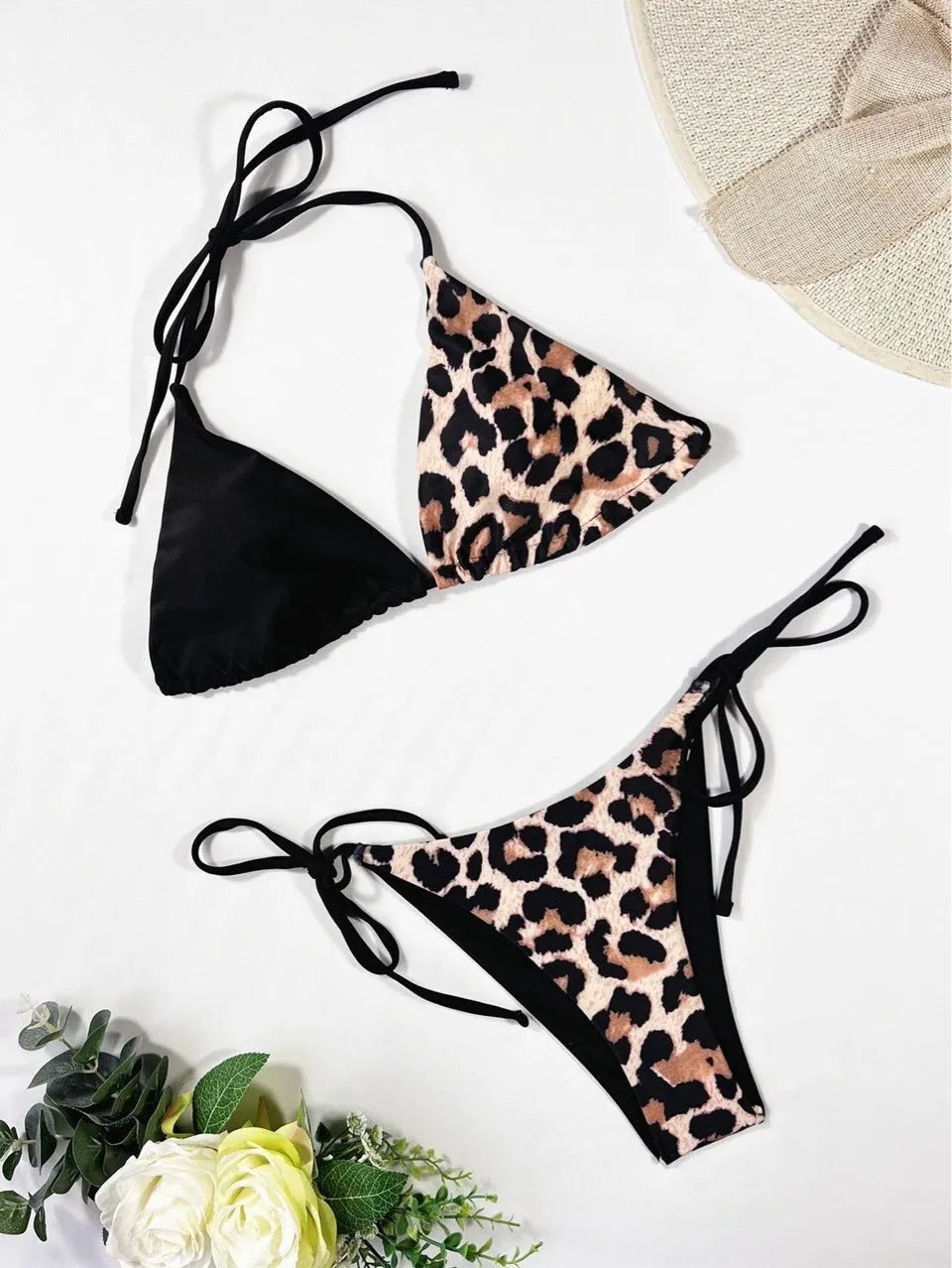 Women's red leopard print halter neck bikini with lace-up front on mannequin