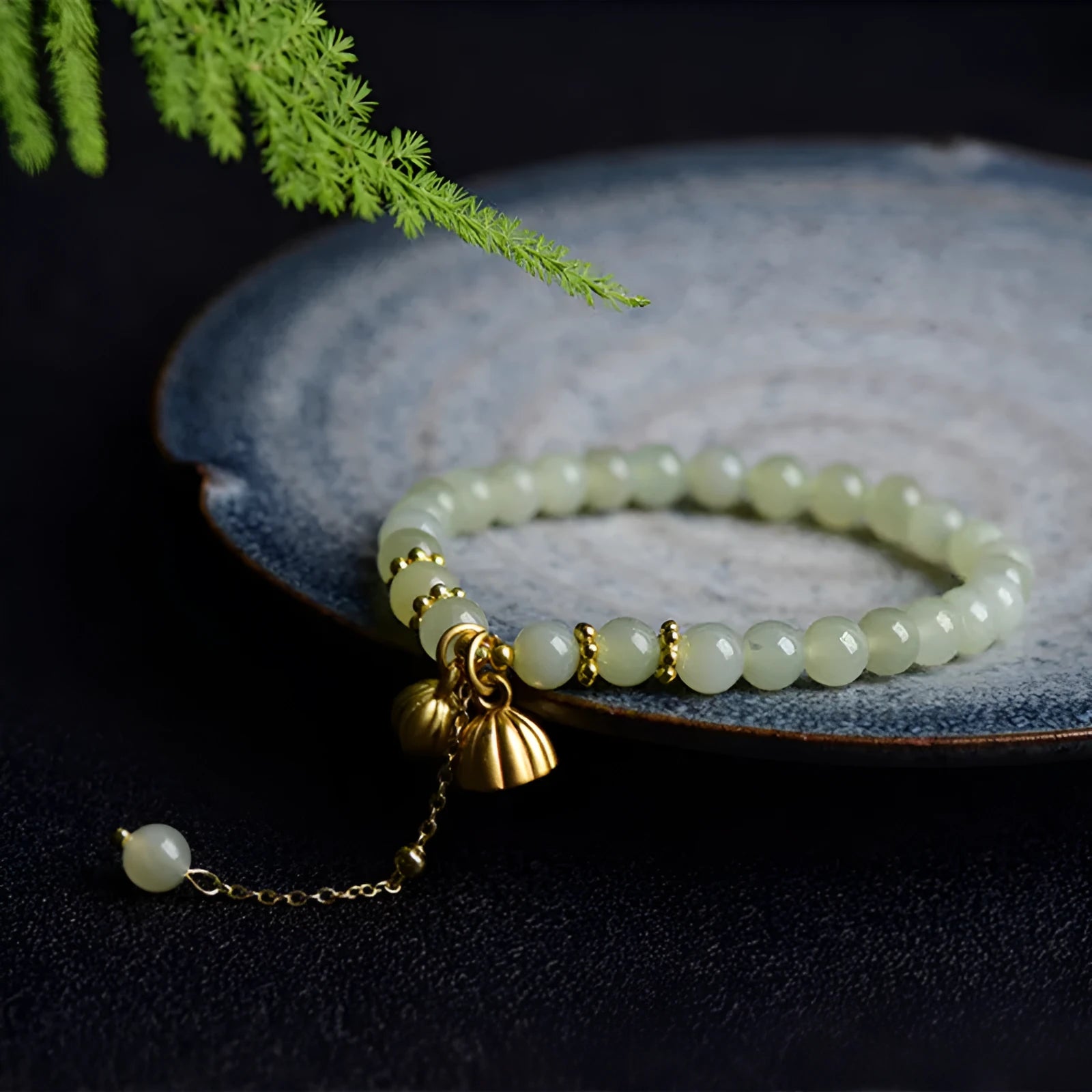 Two Shihuan natural Hetian jade bracelet with 6mm beads, fu charm, and lotus motif on a wrist.