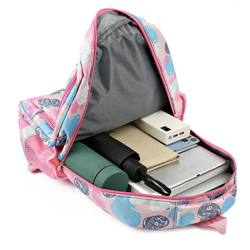 Large blue school backpack with air pillow belt straps on a grey background.