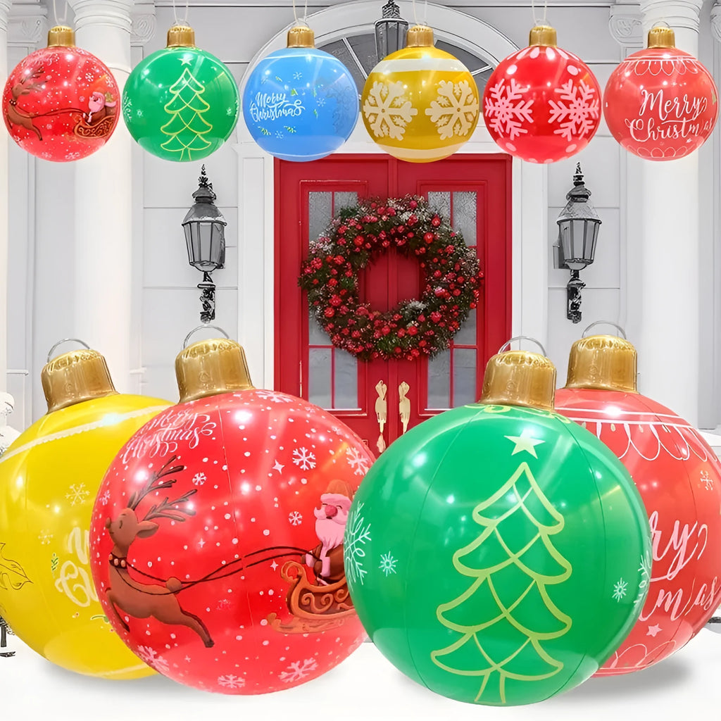 Large red inflatable Christmas ball with flashing lights in garden setting