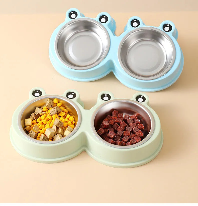 Stainless steel pet double bowl with frog design for cat and dog food and water.