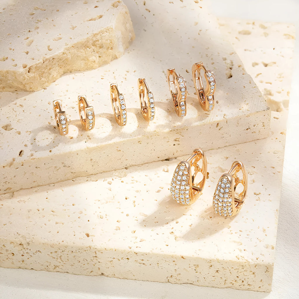 Brass gold plated heart shaped ear clip earrings with simple gang drill elements