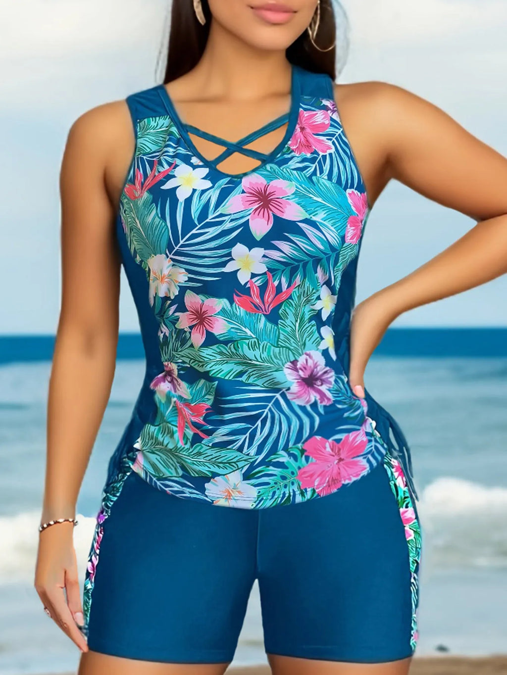Women's plus size floral print high-waist swimsuit bikini in blue on a mannequin.