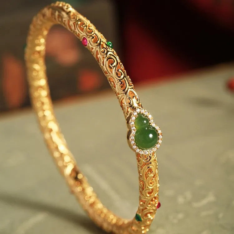 Retro women's bracelet with opening xiangyun gourd charm in gold-plated silk finish on copper base