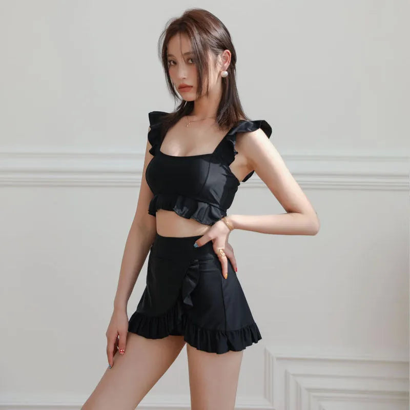 Black women's nylon split swimsuit bikini briefs on hanger