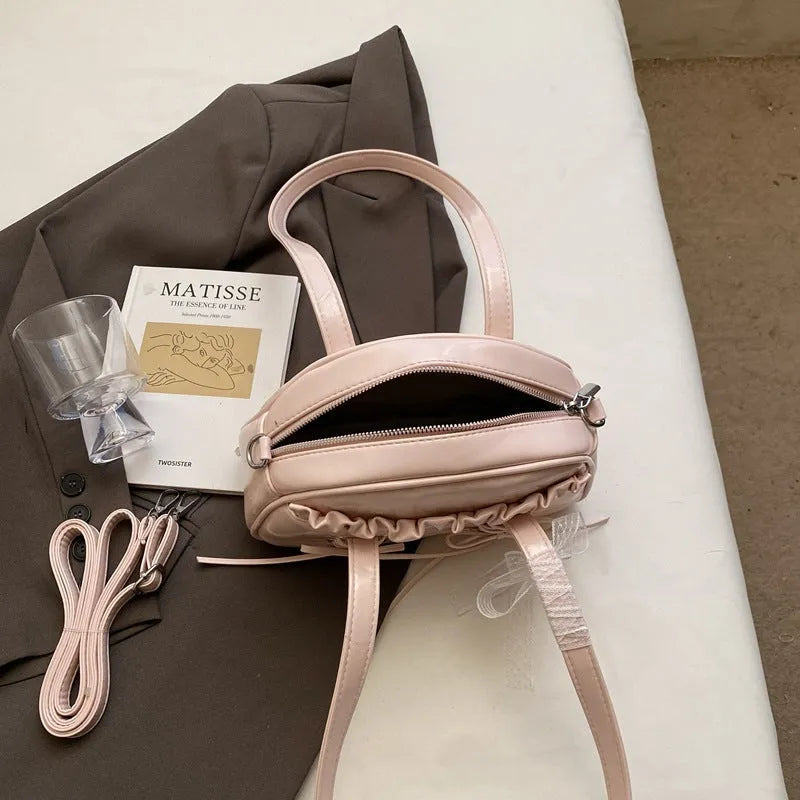 Women's casual shoulder handbag with bandage bow detail and PU leather in milky white colour