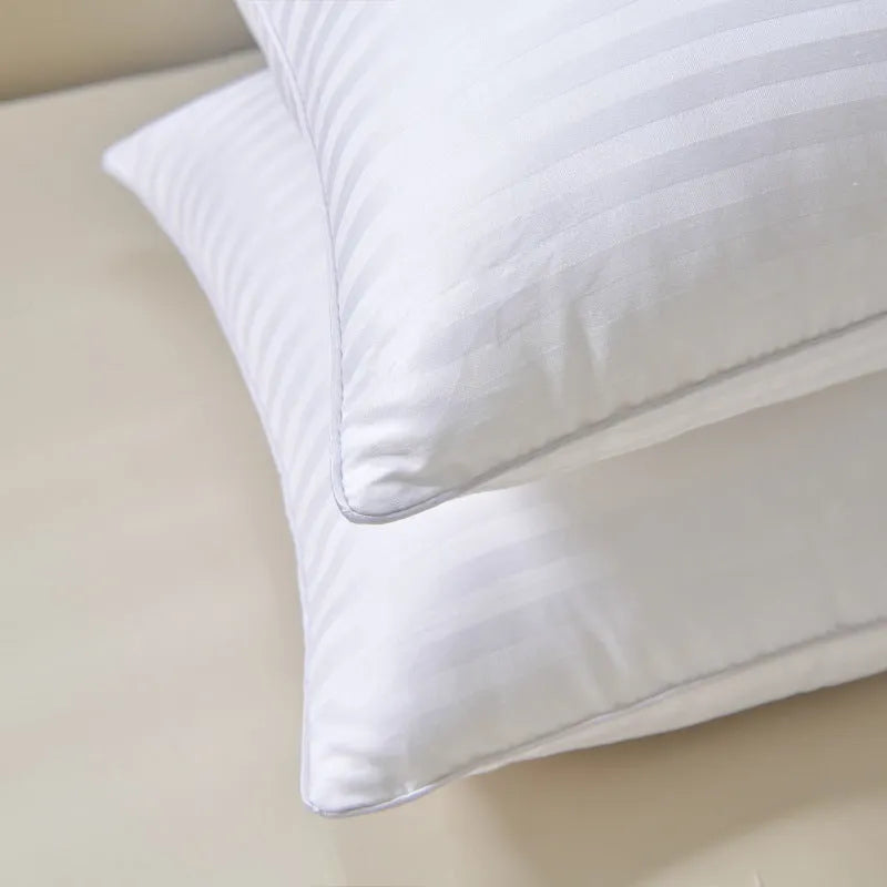 White cotton satin stripe pillow with feather and cotton fill, shown in three different size options.