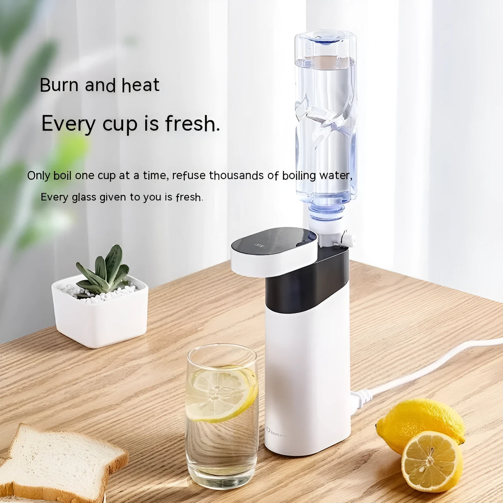 Compact black or green desktop instant water dispenser with digital display on a wooden table.